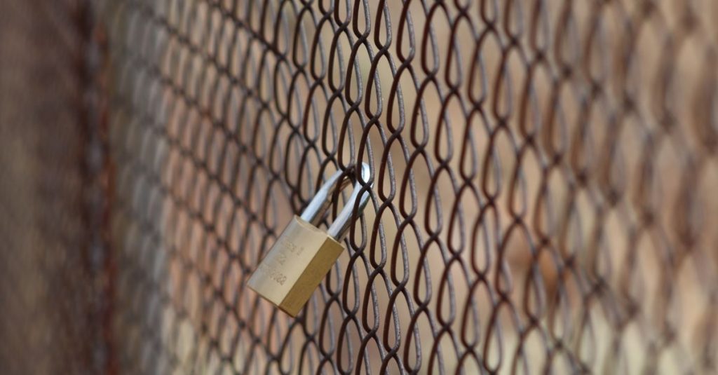 Illustration of a network gateway with a warning sign indicating vulnerabilities